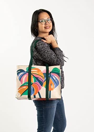 Blue Q Monstera Leaf Shoulder Tote is the carry-everywhere bag featuring a hefty zipper, exterior pocket, wrap-around straps, reinforced floor, 95% recycled material, 11" h x 15" w x 6.25" d